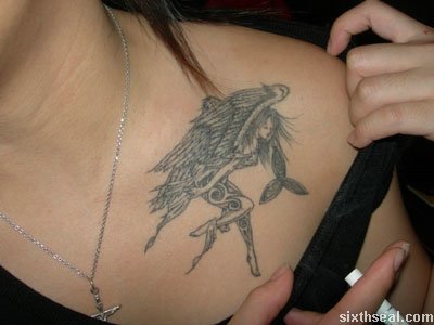 She also has one on her chest same place I have my phoenix tattoo an ink 